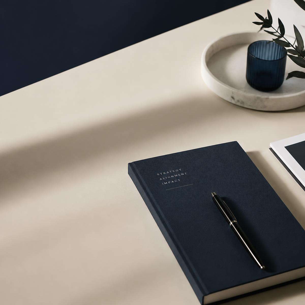 Arghaman strategy notebook on a studio desk